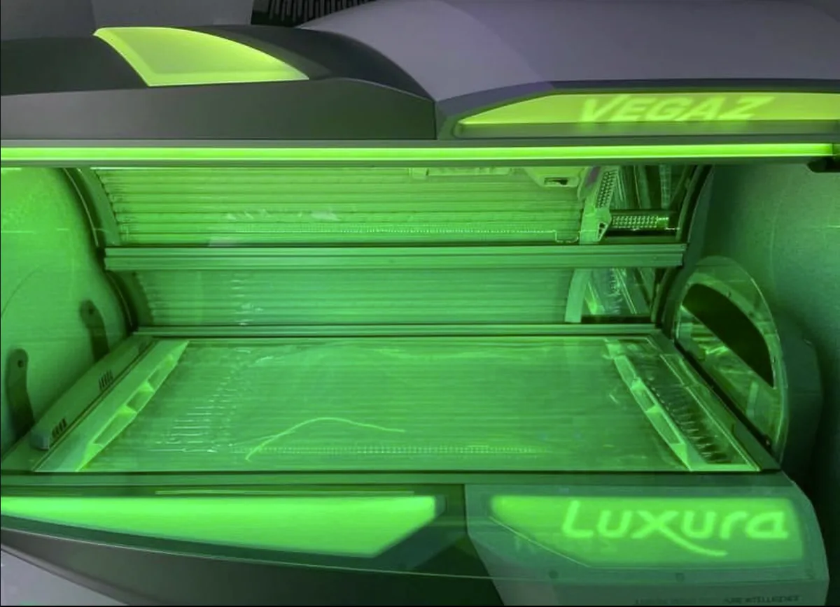 Luxura Vegaz sunbed in emerald-green light